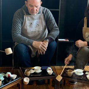 Bill wearing the apron that says: Old Tea